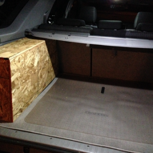 Close-up of plywood cargo organizer before being covered in carpeting.