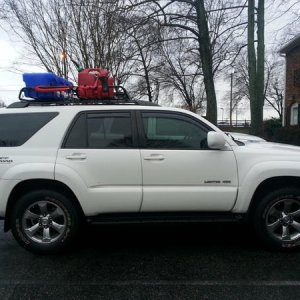 Loading up the roof rack for a hunting trip.