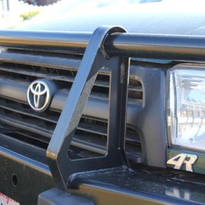 4r cut from rear "4runner" badge. Plasti Dipped grill black. Tacoma ARB bumper