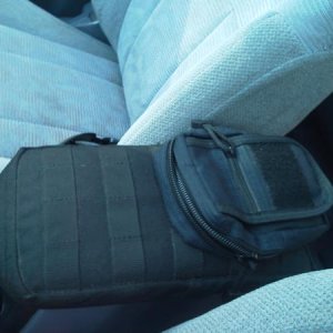 The center console's vinyl was cracked, so I opted to recover it with some cordura nylon. I used a 5.11 6X10 pack for the main cover. The molle webbin