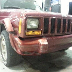 Front view. Doesn't look bad from the pictures, but his hood, quarter panel, bumper, and sub-frame are all damaged, along with a busted radiator, brok