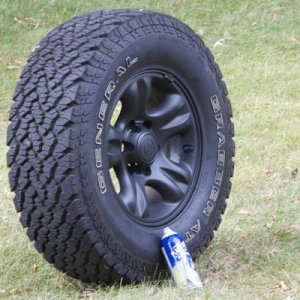Painting my stock rims with plastidip.  It works well.