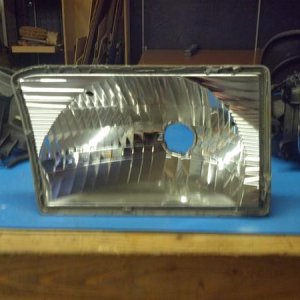 Reflector with glass and center piece removed

I used a heat gun on edge and a razor blade then a wide chisel to pry it open, Sort of a pain but Once 