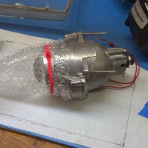 You can Ziptie and tape the bubble wrap over the lense to protect it while you assemble the headlight, also you can stick the bulbs in to keep dust pa