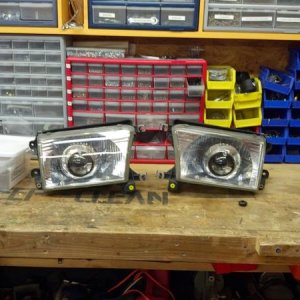 Once youve adjusted the aim of your projector go ahead and replace the glass covers onto the reflectors, if you are completely done, Jb weld the screw