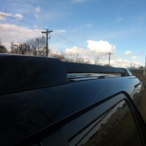 Painted the silver ends of the roof rack gloss black