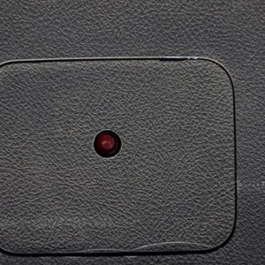 Latch button cover on
