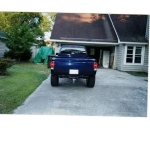 Picture of roll pan, taillights, and hitch on the 99 tacoma