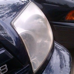 Left dulled/oxidized headlight cover