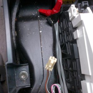 Under the center console trim. More crud and ashes.