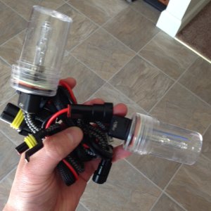 Sweet bulbs bro...thanks I know.  Notice the plastic covers for shipping and high quality mesh covering the wires.  Also notice my linoleum floor.