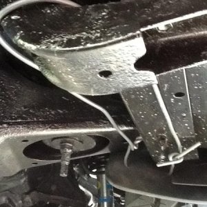 Pulling and securing the front mud flaps back to clear 265/70R17s