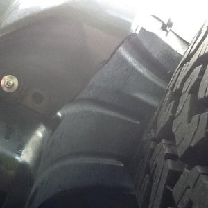 Trimmed fender, relocated front inner fender to clear 265/70R17s