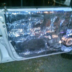 covered my door in sound dampening material yesterday, the pitcher does not look that good cuz i was doing it in the dark but got the front doors done