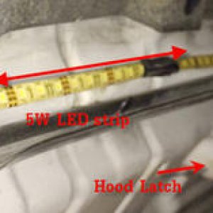 This is a 3.5' strip of 5W per foot LED lighting.  It is heat resistant and glued to the top of the hood.