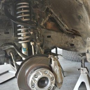 Bilstein 5100, Eibach 620lb spring, Power Slot slotted rotor, Hawk HPS brake pads, and 1 1/4 wheel spacer.