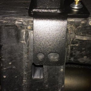 Front passenger side.  No hole for mount.