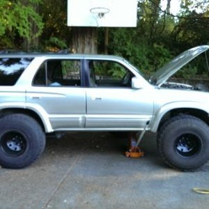 Summer 2014 - jokingly test fitting 35"*12.5"R15's on a stock height 3rd gen… pawl.