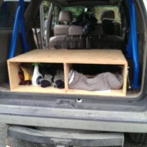 ignore the clutter and half finished storage/sleeper… 1st gen roll bar is in!