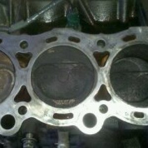 this is the driver side head sure looks to me like the head gasket was blown as clean as that one piston is but toyota "said" it wasnt