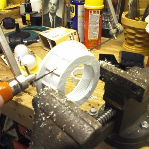 PVC "drainplate" fitting being cut to size