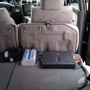 one of my amp. mounted to the back of the rear seat.