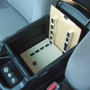 Safe is bolted down from the inside of the safe to the existing place where the center console was attached.
