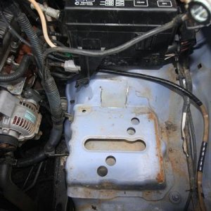 cut battery clamp bracket, cut fuse box mount, both plastic and metal
