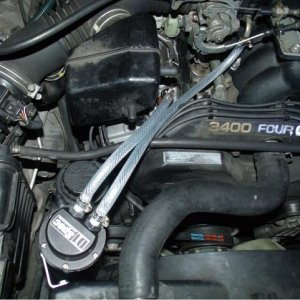 Catch can, redirects oil and residue into the can where it settles and out of the intake.