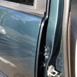 Door jambs with original paint next to new paint from Maaco.