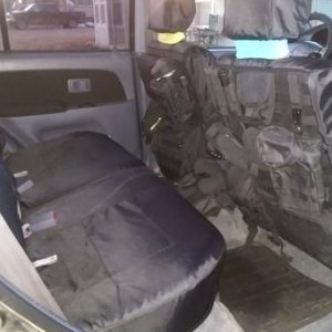 New custom seat covers and molle pouches! Recovered door panels too!