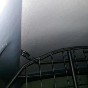 I installed factory d rings in the roof to attach and secure the top part of the barrier.