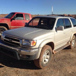 Getting dirty in the mud out at work. My friend kory's truck in the background