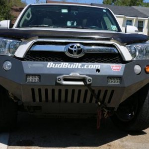 Budbuilt front bumper (new Feb 2012), Warn M8000, mounted in bumper synthetic winch (new Dec 2013).  Two Rigid, 6" LED lights mounted in bumper.