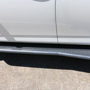 Budbuilt sliders with bumpouts, powder-coated grey, matching front bumper.  Note, I still have original rocker panels from new, they are free to buyer
