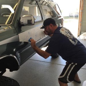 Stripe man installing the OEM replicas from James Dean creations in Tucson