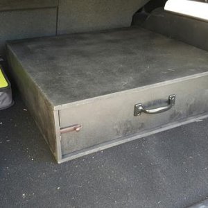 Storage drawer. Modular, allows for stacking and seats to be folded.