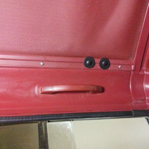 5/16" x 3" carriage bolts with 3/8" x  1-1/2" fender washer then 3/8" x 1-1/2" neoprene washer on inside. Filled holes with clear rtv silicone, put bo