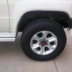 Cut the running board for some extra clearance. About 5/8" on top and closer to 1-1/2" at the bottom.