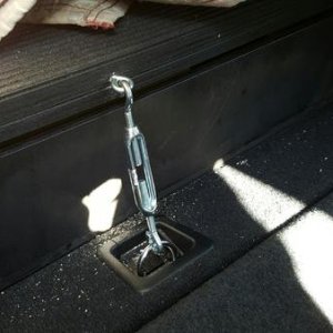 Turnbuckle for drawer hold-down.