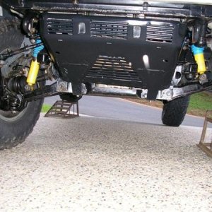 Even with simple inspection ramps the IFS flexes well. The standard jack has to go under the control arm otherwise the tyre won't lift off the ground.