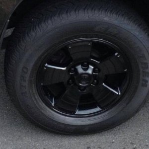 My cousin painted my wheels for the cost of paint and a 12-pack of Heineken.