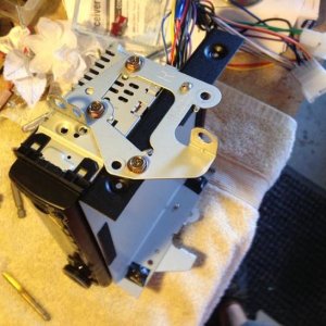 Drilled/tapped radio bracket to accept CB radio and use Toyota OEM bolts.