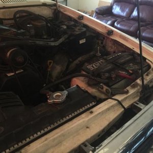 Battery/overflow relocation... And yes that's a couch in my garage :)