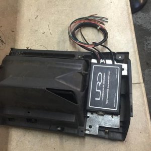 URD box behind the glove box panel. 2nd gens don't have much room to hide it