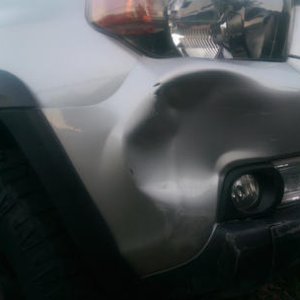 Somebody decided N-B-B was just too purdy and could use some damage. :( This was from "backing into a parking space" next to me.... WTF! On the bright