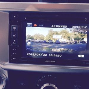 I routed the AV out of the dashcam to the AV In on my Alpine HU