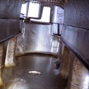 Inside the intake, oil puddle in the back