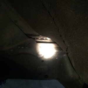 Single breather tube along driver side frame rail