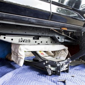 We used a jack to help us raise the C4 Fab Fuel Tank skid and position it where we needed it
